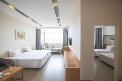 Ένα ή περισσότερα κρεβάτια σε δωμάτιο στο Sammy Hotel