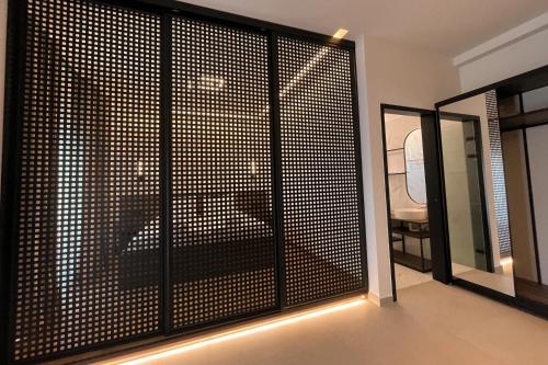 a room with a sliding glass door with a view of a room at Salt Boutique Hotel in Palouki