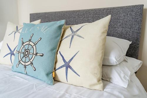 a bed with two pillows with a star ship on it at Sunny Seaside Beach House Lytham Centre sleeps 8 in Lytham St Annes