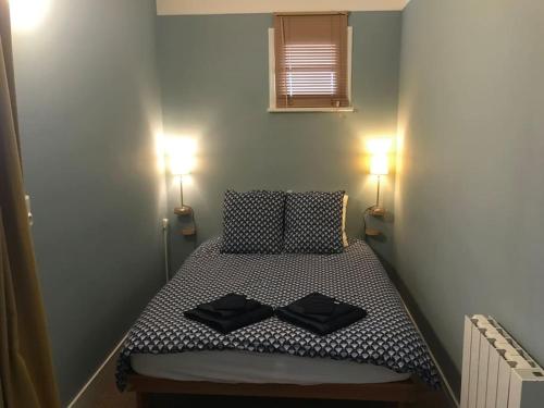 Postel nebo postele na pokoji v ubytování Appartement cosy avec vue mer