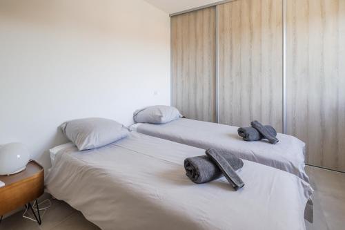 Ein Bett oder Betten in einem Zimmer der Unterkunft Bella Luce - Appt vue panoramique mer