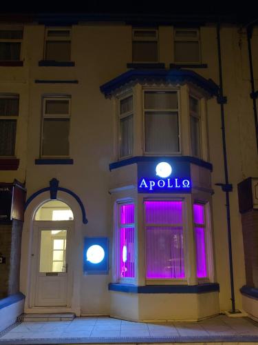 a building with an apollo sign in the window at night at The New Apollo Hotel in Blackpool