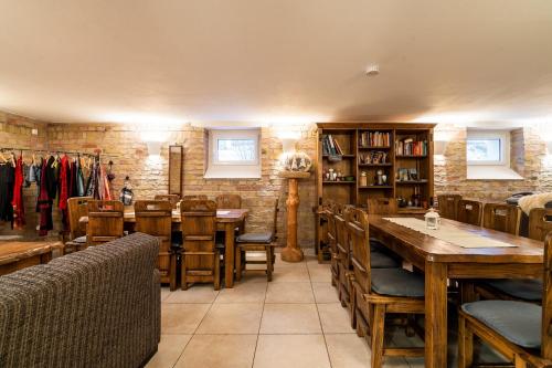 a dining room with wooden tables and chairs at Apartment Felswelten in Bielatal
