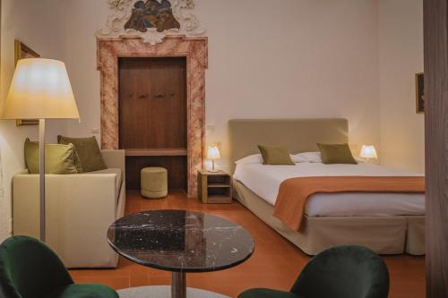 Postel nebo postele na pokoji v ubytování Hotel Villa Montegranelli