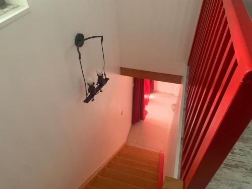 a view of a staircase with a red light at Maison entière avec sauna privatif Sauna sur Sye in Aouste-sur-Sye