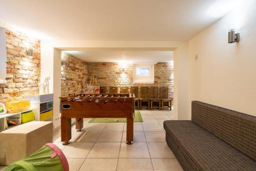 a room with a ping pong table in it at Apartment Felswelten in Bielatal