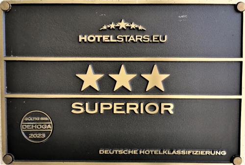 a sign with four stars on it with a hotel stälv at Hotel Garni Jägerhof in Sigmaringen