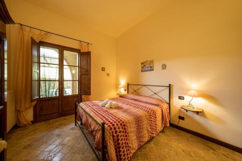Postel nebo postele na pokoji v ubytování Agriturismo Due Ponti