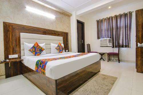 Postel nebo postele na pokoji v ubytování FabHotel Airport Avalon - Nr IGI Airport New Delhi