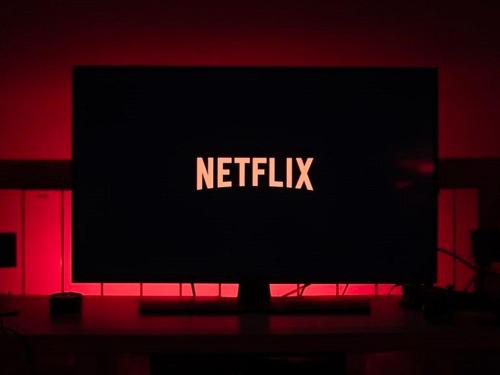 a television screen with the netflix logo on it in a dark room at Amazing Apartment Disneyland Paris in Chessy