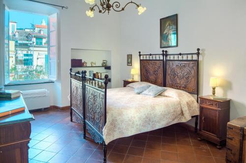 a bedroom with a large bed and a window at Chiara House in Levanto