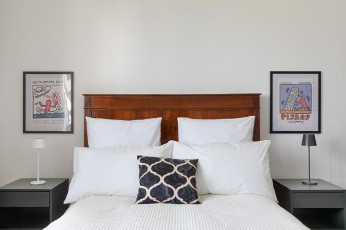 a bedroom with a large bed with white pillows at Casa Cairoli in Mira