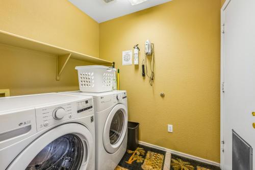 a laundry room with a washer and dryer at Palm Valley Oasis in Goodyear