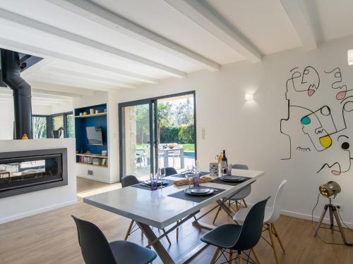 a dining room with a table and chairs at Holiday Home Breizh Riviera - BNO107 by Interhome in Bénodet