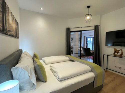 Televisyen dan/atau pusat hiburan di Apartment Panoramablick by Interhome