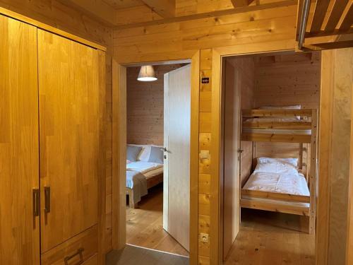 a small room with two bunk beds in it at Chalet Wildenbach by Interhome in Grafenweg