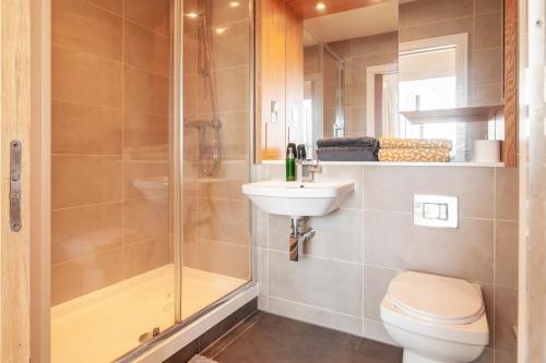 a bathroom with a shower and a toilet and a sink at Modern Double Room - Haywards Heath in Haywards Heath