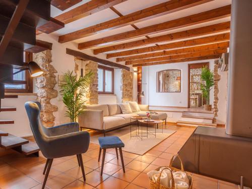 Posezení v ubytování Holiday Home Biniarroi Charm & Quality by Interhome