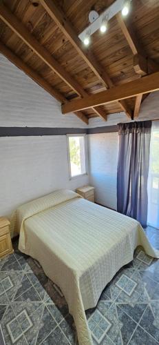 a bedroom with a large bed in a room at Duplex de Playa in Playa Unión