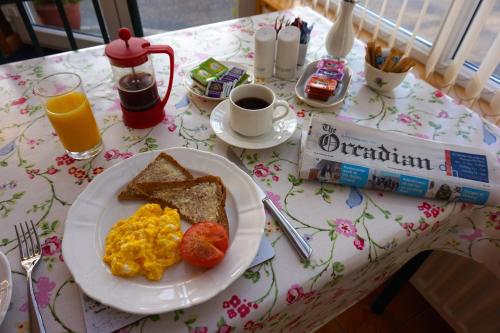 a breakfast plate of eggs and toast on a table at Karrawa Guest House in Kirkwall