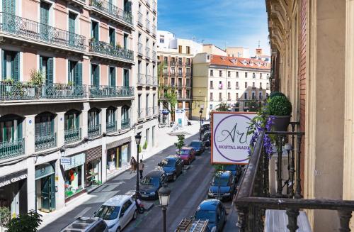 a view of a city street with cars parked at Hostal Art Madrid in Madrid