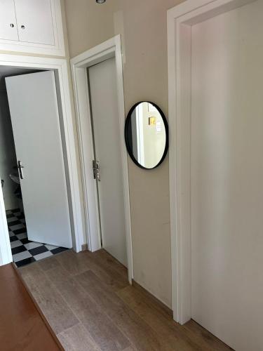 a hallway with a mirror on the wall at Alexandros in Pýrgos