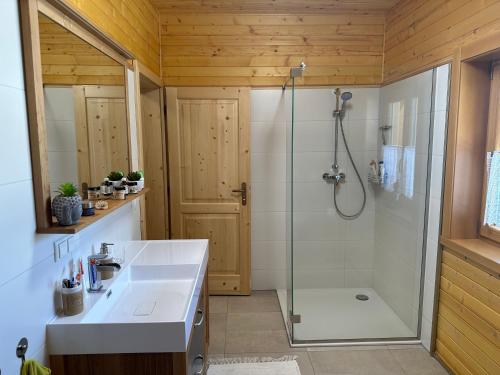 a bathroom with a shower and a sink at Chalet Hochrindl 2 B in Hochrindl