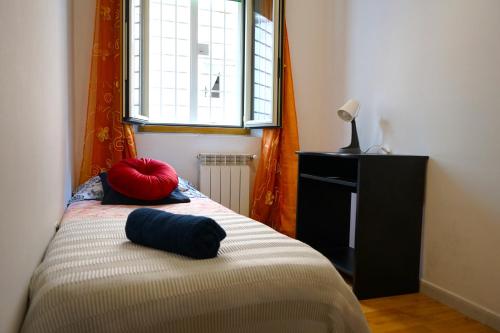 a bedroom with a bed with two pillows on it at Mikasa Balduina Roma in Rome