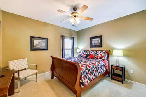 a bedroom with a bed and a ceiling fan at Spacious Family Home 3 Mi to Downtown Fayetteville in Fayetteville