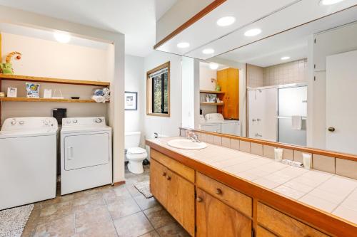 a large bathroom with a washer and dryer at Sea View in Sea Ranch