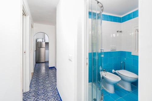 a bathroom with two toilets and a glass shower at Positano Dream Home in Positano