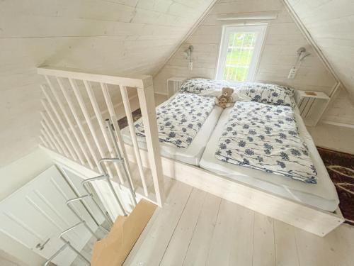 Ένα ή περισσότερα κρεβάτια σε δωμάτιο στο Holiday Home tiny lavender house by Interhome