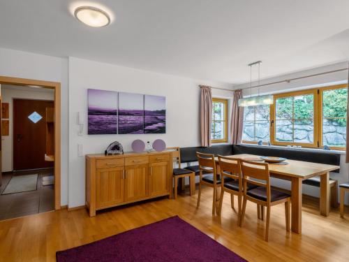 a dining room with a table and chairs at Chalet Chalet Pflaume by Interhome in Bad Gastein