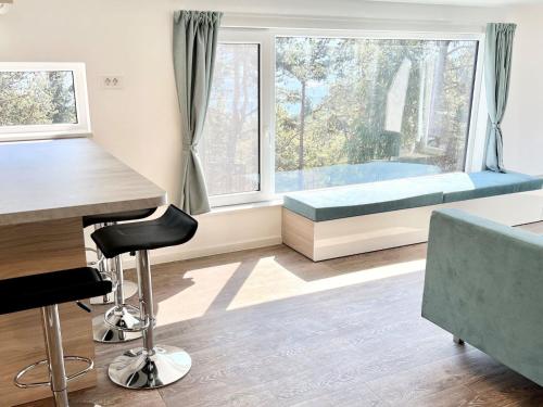 a room with a bed and a desk and a window at Holiday Home Sky-Chalet by Interhome in Imst