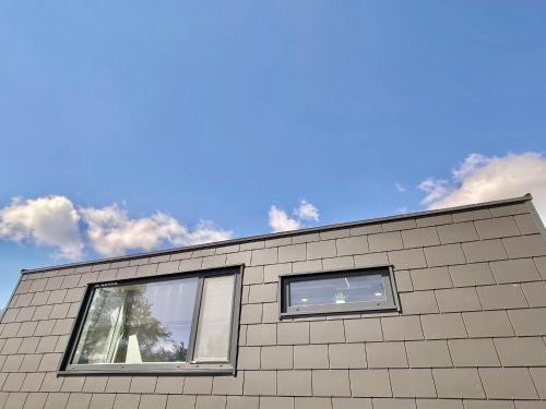 two windows on the side of a building at Holiday Home Sky-Chalet by Interhome in Imst