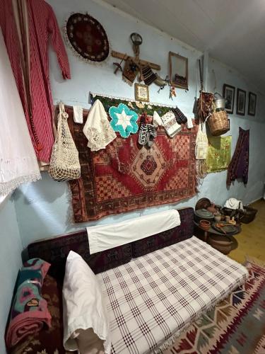 a room with a bed with blankets and other items on the wall at Nur home1 Abuzer Yegin in Istanbul