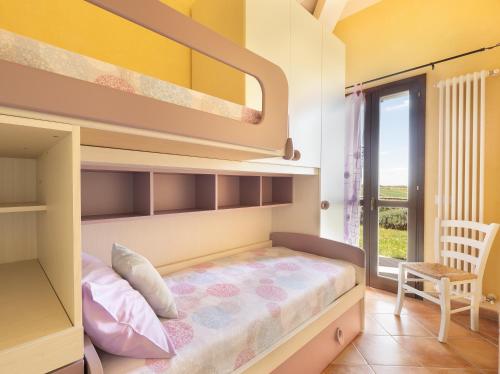 a bedroom with a bunk bed and a balcony at Sweet Home Contignano in Contignano
