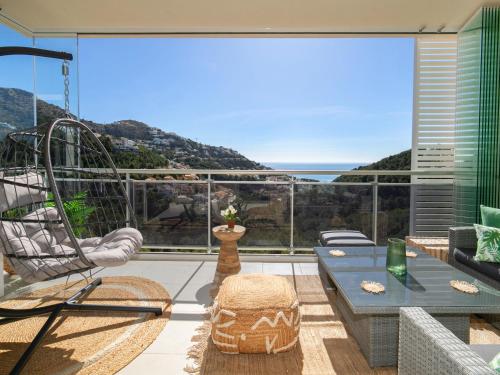a living room with a view of the ocean at Apartment Jardines de Altea Hills-4 by Interhome in Altea