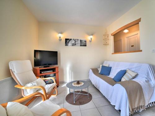 Et tv og/eller underholdning på Holiday Home Le Riveau by Interhome