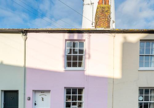 a colourful house with a chimney on top of it at Shrimpers in Southwold