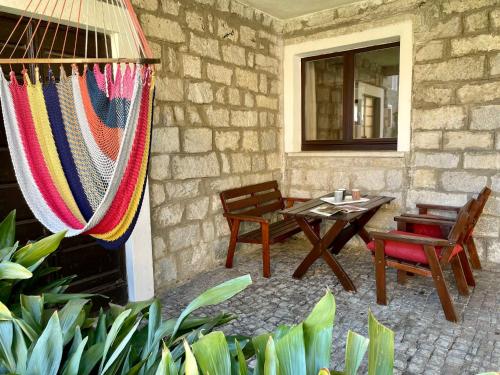 a patio with a hammock and a table and chairs at Apartment Mila by Interhome in Colico