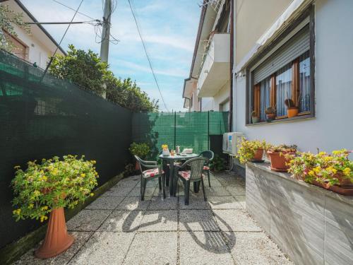 a small patio with a table and chairs on a balcony at Holiday Home Rita by Interhome in Torre del Lago Puccini