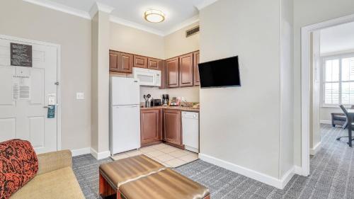 a living room with a kitchen and a couch at Staybridge Suites Savannah Historic District by IHG in Savannah