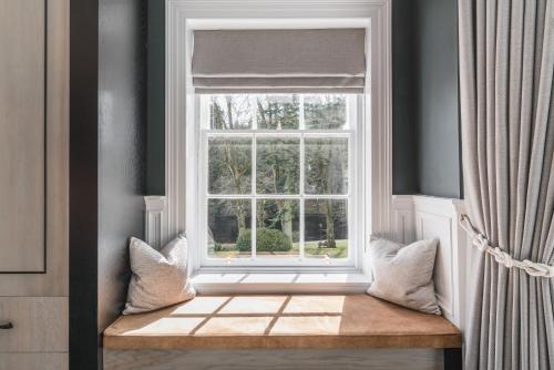 a window with a bench in front of it at Dunkeld House Hotel in Dunkeld
