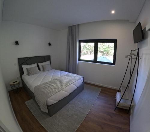 Un pat sau paturi într-o cameră la Casa de Pinheiral