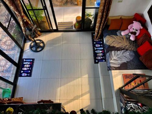 an overhead view of a room with two bunk beds at Dicimulacion Staycation House in Angono