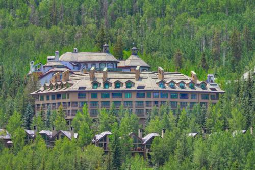 a large building on the side of a mountain at The Pines Lodge, a RockResort in Beaver Creek