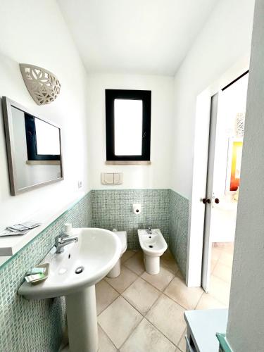 a bathroom with a sink and a toilet at Balconcino d'Oriente in Otranto