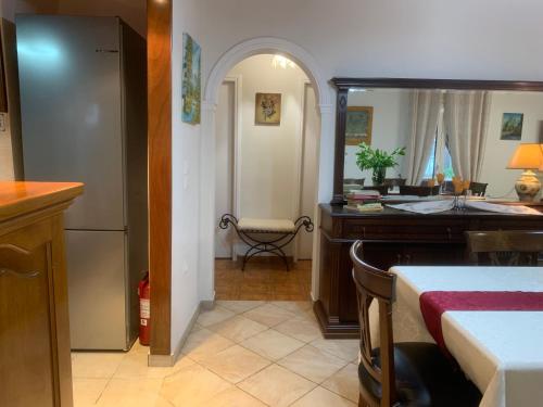 a kitchen with a sink and a refrigerator at Diamanto's Home in Kastanéa