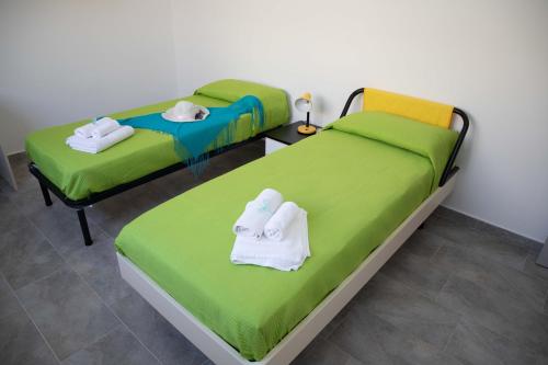 Säng eller sängar i ett rum på Appartamento Profumo di Mare